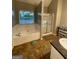 This bathroom is equipped with double sinks, shower, tub, and natural light at 75 Trelawney Keep, Covington, GA 30016