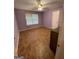 The spacious bedroom features tile flooring, ceiling fan, and a large window for natural light at 75 Trelawney Keep, Covington, GA 30016