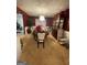 Dining room with a large table, decorative chandelier, and rich red walls at 75 Trelawney Keep, Covington, GA 30016