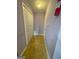 Hallway featuring tile flooring and a closet, with access to the exterior at 75 Trelawney Keep, Covington, GA 30016