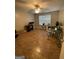 This home office features tile flooring, a large window, and ample space for multiple desks at 75 Trelawney Keep, Covington, GA 30016