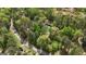 Aerial view showcasing house amidst a lush, green, wooded area at 5350 Hearn, Ellenwood, GA 30294
