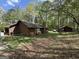 View of a large backyard, partially wooded at 5350 Hearn, Ellenwood, GA 30294