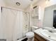 Bathroom featuring shower-tub combo, toilet, vanity, and cabinet at 5350 Hearn, Ellenwood, GA 30294