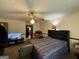 View of bedroom featuring carpet, ceiling fan, and black headboard at 5350 Hearn, Ellenwood, GA 30294