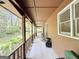 Long, covered front porch with rocking chairs that provides a cozy outdoor space at 5350 Hearn, Ellenwood, GA 30294