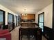 Open dining area with tile floors and kitchen visible in the background at 5350 Hearn, Ellenwood, GA 30294