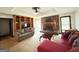 Spacious living room with a stone fireplace, wood built-ins, and lots of natural light at 5350 Hearn, Ellenwood, GA 30294