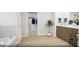 Bathroom featuring a bathtub and walk-in closet with double vanity, wood floors, and modern fixtures at 1246 Trombone Way # 111, Mcdonough, GA 30252