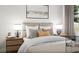 This bedroom features neutral decor and modern lighting, creating a calming and inviting atmosphere at 1246 Trombone Way # 111, Mcdonough, GA 30252