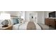 This bedroom boasts a walk-in closet, a comfortable bed, and a wooden dresser for a cozy retreat at 1246 Trombone Way # 111, Mcdonough, GA 30252
