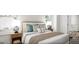 Inviting bedroom with a comfortable bed, nightstands, lamps, and natural light at 1246 Trombone Way # 111, Mcdonough, GA 30252