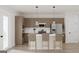 Modern kitchen featuring stainless steel appliances, sleek countertops, stylish barstool seating, and ample cabinet space at 1246 Trombone Way # 111, Mcdonough, GA 30252