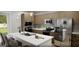 Well-equipped kitchen with stainless steel appliances, a center island with seating, and modern cabinetry and countertops at 1246 Trombone Way # 111, Mcdonough, GA 30252