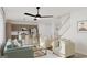 Bright, open-concept living space with modern furnishings, a cozy seating area, and a view of the updated kitchen at 1246 Trombone Way # 111, Mcdonough, GA 30252