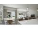 Open concept dining area features a round wood table, white chairs and natural lighting at 2020 Piccolo Ct # 229, Mcdonough, GA 30252