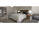 Inviting bedroom boasts comfortable seating and serene ambiance with neutral color palette at 2024 Piccolo Ct # 228, Mcdonough, GA 30252