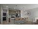Modern kitchen featuring a central island, stainless steel appliances, and stylish pendant lighting at 2024 Piccolo Ct # 228, Mcdonough, GA 30252
