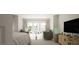 Spacious main bedroom features large windows, sitting area, and elegant decor at 2024 Piccolo Ct # 228, Mcdonough, GA 30252