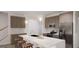 Modern kitchen with stainless steel appliances, a spacious island, and stylish pendant lighting at 2036 Piccolo Ct # 225, Mcdonough, GA 30252