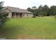 Expansive backyard featuring a large lawn and surrounding trees at 376 Turner Cir, Mcdonough, GA 30252