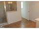 Bathroom with a tiled shower and a glass shower door at 376 Turner Cir, Mcdonough, GA 30252