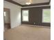 Serene bedroom features plush carpeting, tray ceiling, and large windows for natural light at 376 Turner Cir, Mcdonough, GA 30252