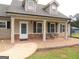 Charming home with a cozy front porch and decorative stone accents at 376 Turner Cir, Mcdonough, GA 30252