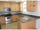 Efficient kitchen featuring stainless steel appliances and ample granite counter space at 376 Turner Cir, Mcdonough, GA 30252