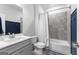 Full bathroom with blue accents and modern fixtures featuring neutral paint and tile at 510 Cunninghame Ct, Peachtree City, GA 30269
