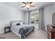 Cozy bedroom with a wrought iron bed frame, soft textures, and a calming color scheme at 510 Cunninghame Ct, Peachtree City, GA 30269