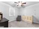 Neutral Bedroom with a ceiling fan, area rug, and ample natural light streaming through the window at 510 Cunninghame Ct, Peachtree City, GA 30269