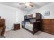 Cozy bedroom with bunk beds, ceiling fan and nice dresser, featuring neutral paint and carpet at 510 Cunninghame Ct, Peachtree City, GA 30269