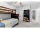 Cozy bedroom with bunk beds, ceiling fan and bookcase, featuring neutral paint and carpet at 510 Cunninghame Ct, Peachtree City, GA 30269