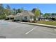 Community clubhouse with ample parking and a glimpse of the pool, offering convenient amenities for residents at 510 Cunninghame Ct, Peachtree City, GA 30269