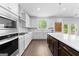 Modern kitchen with stainless steel appliances, white cabinets, and a spacious island for dining and food prep at 510 Cunninghame Ct, Peachtree City, GA 30269