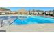 A clear blue community pool with steel ladder and tile accents, surrounded by lounge chairs and a pool house at 510 Cunninghame Ct, Peachtree City, GA 30269