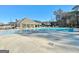 Community pool area with a pool house, ample seating, and clear blue water, perfect for relaxation and recreation at 510 Cunninghame Ct, Peachtree City, GA 30269