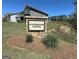 The stone entrance sign for Wilksmoor Woods, set amongst landscaping, welcomes visitors to the neighborhood at 510 Cunninghame Ct, Peachtree City, GA 30269