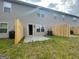 View of the backyard with a patio and wood privacy fence at 5257 Carrie Dr, Morrow, GA 30260