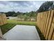 View of a backyard with wood fence and concrete patio at 5257 Carrie Dr, Morrow, GA 30260