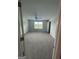 Large bedroom featuring neutral carpet, a ceiling fan, and natural light from the window at 5257 Carrie Dr, Morrow, GA 30260