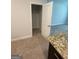 View into closet with closet rod; part of the bedroom area is in view at 5257 Carrie Dr, Morrow, GA 30260