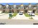 View of the townhouse complex showing each unit with garages, driveways and small lawn at 5257 Carrie Dr, Morrow, GA 30260