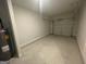 View of an attached garage with cement floor and garage door at 5257 Carrie Dr, Morrow, GA 30260