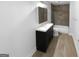 Modern bathroom with a stylish vanity, tiled shower, and a neutral color scheme at 355 New Marietta Hwy, Roswell, GA 30075