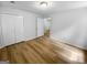 Bedroom features closet, an opening to the hallway and wood-look floors at 355 New Marietta Hwy, Roswell, GA 30075