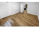 Comfortable bedroom with wood-look flooring, closet, and an en-suite bathroom at 355 New Marietta Hwy, Roswell, GA 30075