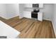 Modern kitchen with stainless steel appliances, white countertops, and ample cabinet space at 355 New Marietta Hwy, Roswell, GA 30075