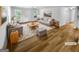 Staged living room featuring modern furniture, a patterned rug and natural light at 355 New Marietta Hwy, Roswell, GA 30075